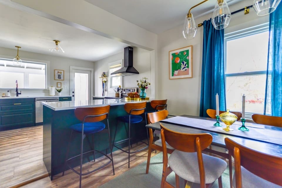 The kitchen features a spacious island in an open-concept layout that flows seamlessly into the dining area.