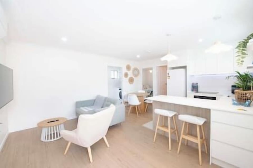 Light-filled living area with comfy seating and a relaxed open layout.