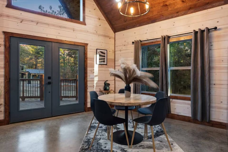 From morning coffee at the table to afternoon dips in the pool, the flow of this home is effortless. These double doors lead directly out to your private playground, making it easy to transition from indoor dining to outdoor `Par-Teeing.`