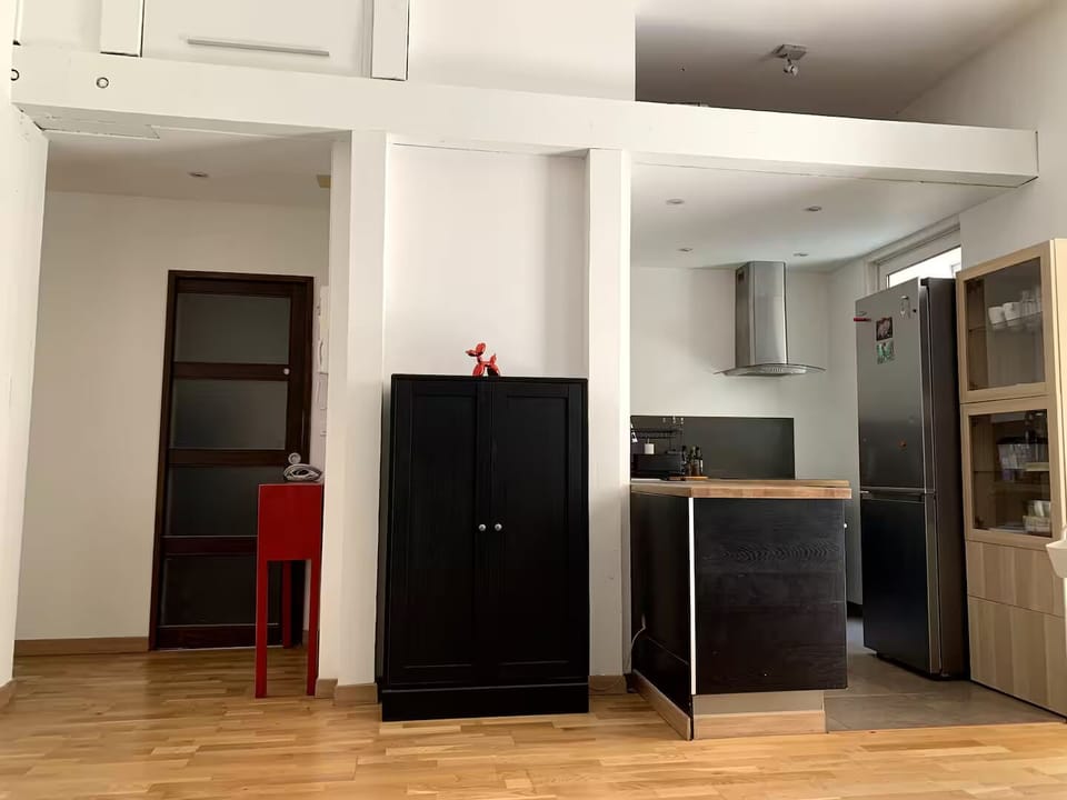 Looking from the couch towards the kitchen on the right and bathroom on the left