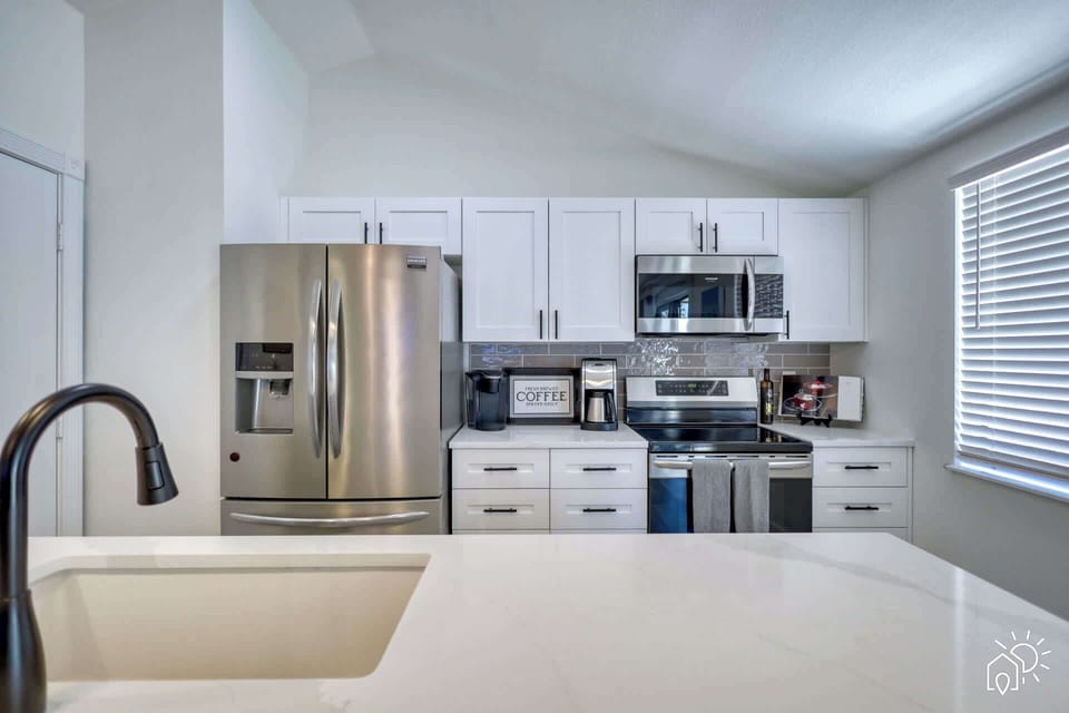Kitchen: Sleek appliances and stylish decor await your culinary adventures in sunny Bradenton!
