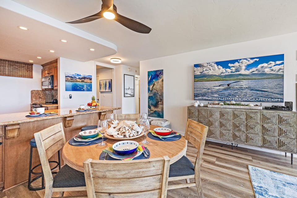 Inviting dining area featuring colorful place settings and a bright, airy layout.