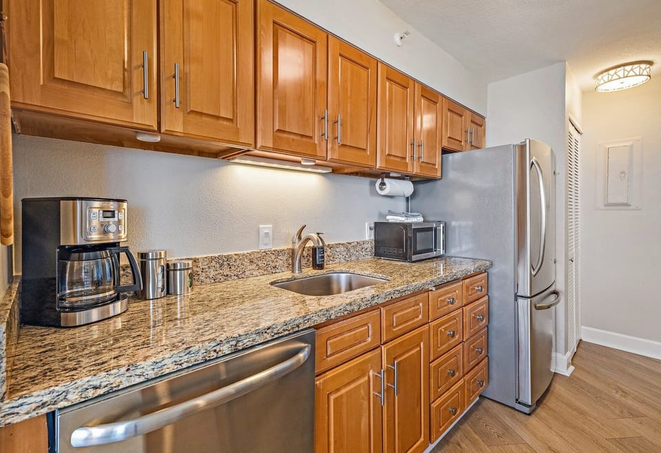 Spacious kitchen with extended countertop space, full appliances, and clear views toward the ocean.