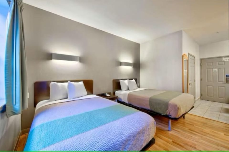 Settle in comfortably with two cozy beds and soft lighting.