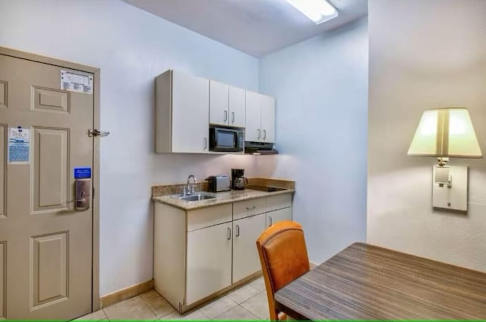 Start mornings easily with an in-room kitchenette and coffee setup.