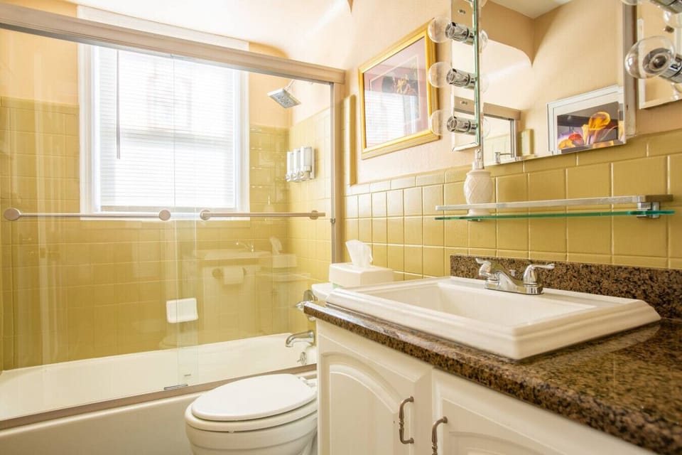 Bright and updated full bathroom featuring tub and shower combination