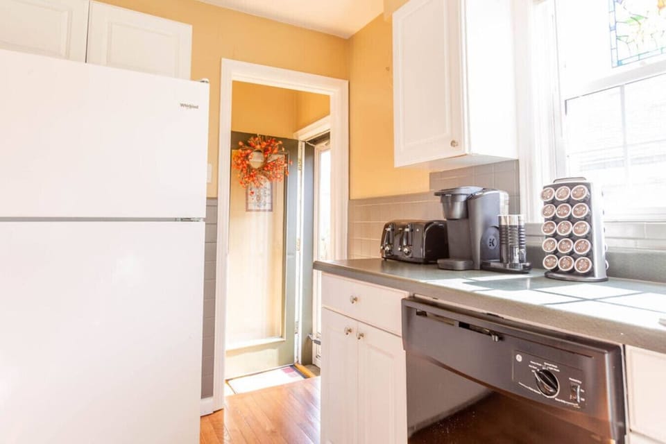 kitchen equipped with gas range, microwave, and fully stocked cabinetry