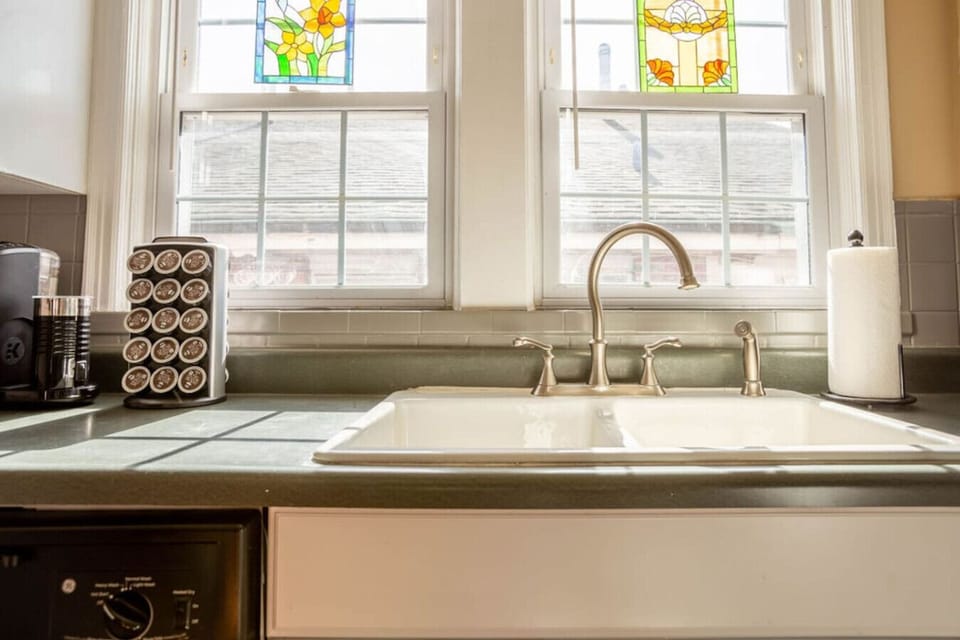 kitchen equipped with gas range, microwave, and fully stocked cabinetry