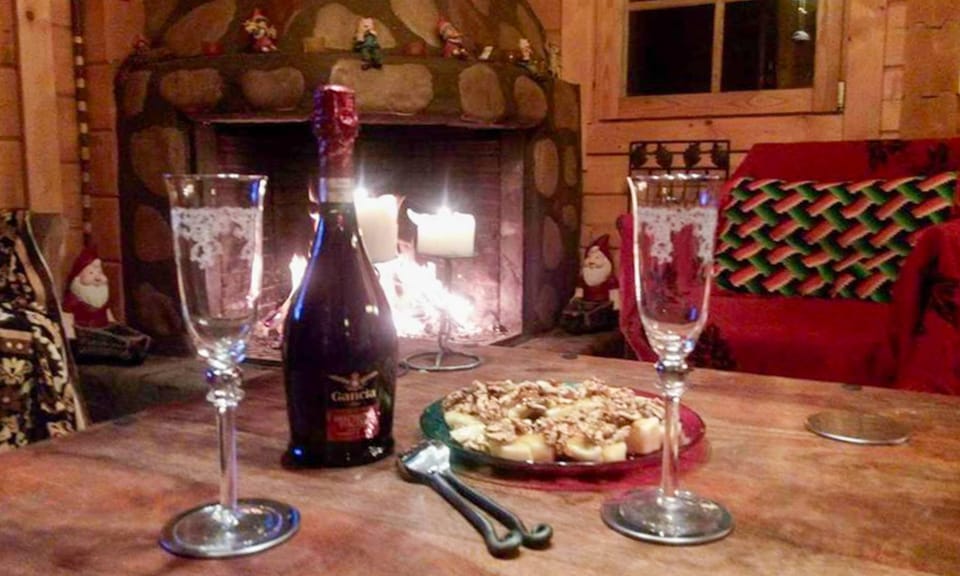 Fireplace & wine setting. Intimate fireside table with wine glasses, promising relaxed evenings in this mountain home