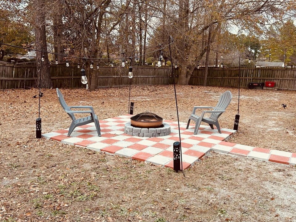 Gather around the backyard fire pit—perfect for morning coffee, afternoon chats, or evening s’mores.