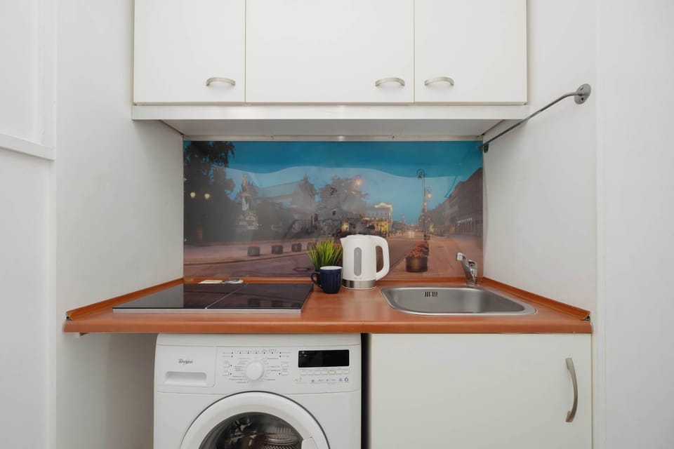 The compact kitchen layout with easy access to appliances simplifies daily routines, offering everything you need in one spot.
