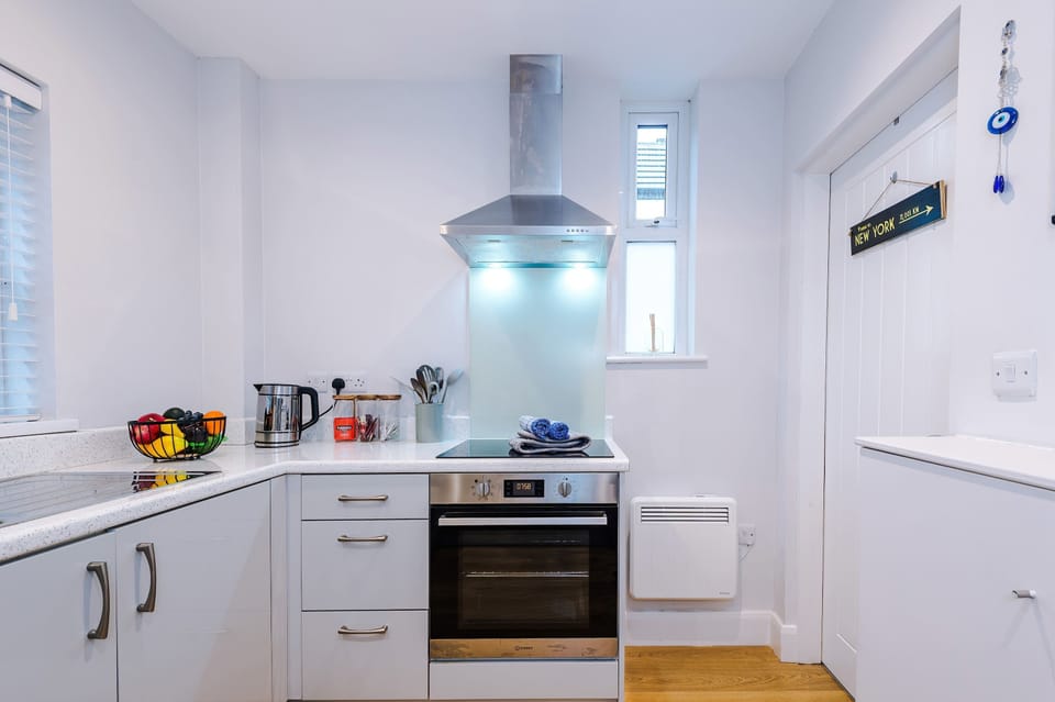 The modern kitchen is fully equipped with an electric hob, oven, ketle, toaster and nespresso machine so you can cook like you are right at home!