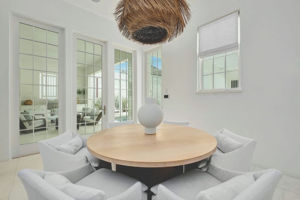 Host long, laughter-filled dinners beneath sculptural coastal lighting.