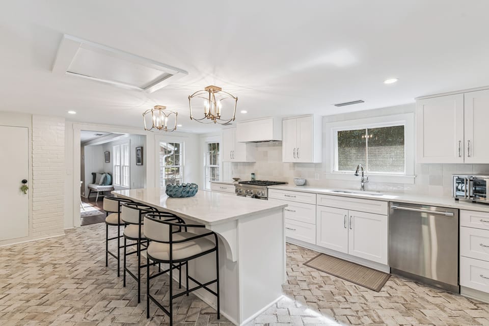 Your dream kitchen awaits with gleaming counters, modern appliances, and elegant pendant lighting creating the perfect space for memorable meals.
