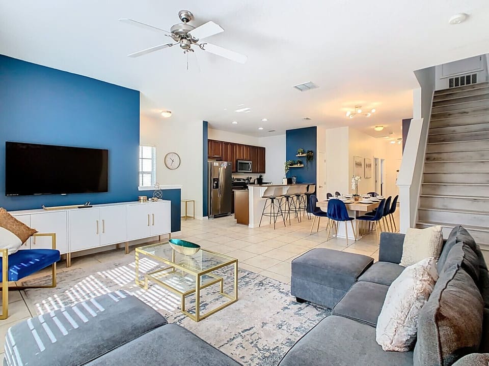 Open-concept dining and living space with modern décor and a spacious layout.