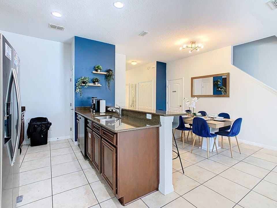 Inviting dining space with stylish blue chairs and a clean, modern design.