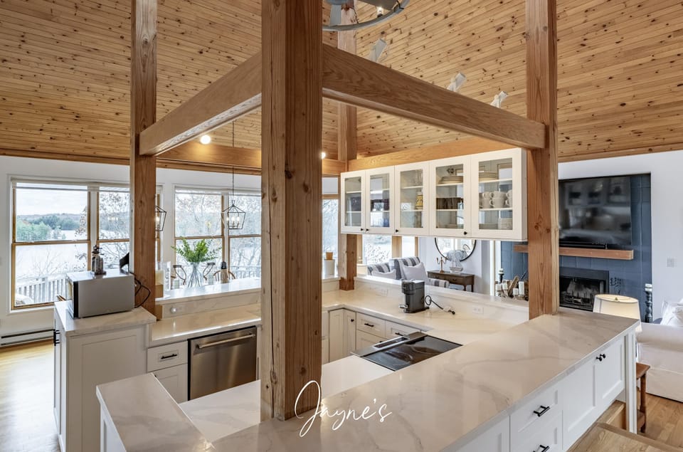 Sunlit kitchen with panoramic water views and modern comfort