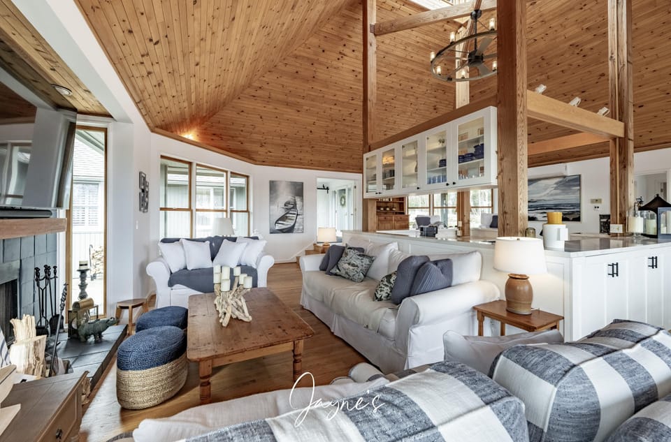 Spacious living room with vaulted ceilings and cozy fireplace