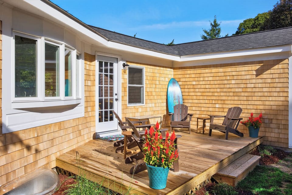 Rear deck with Adirondack chairs to unwind or have morning coffee in the sun