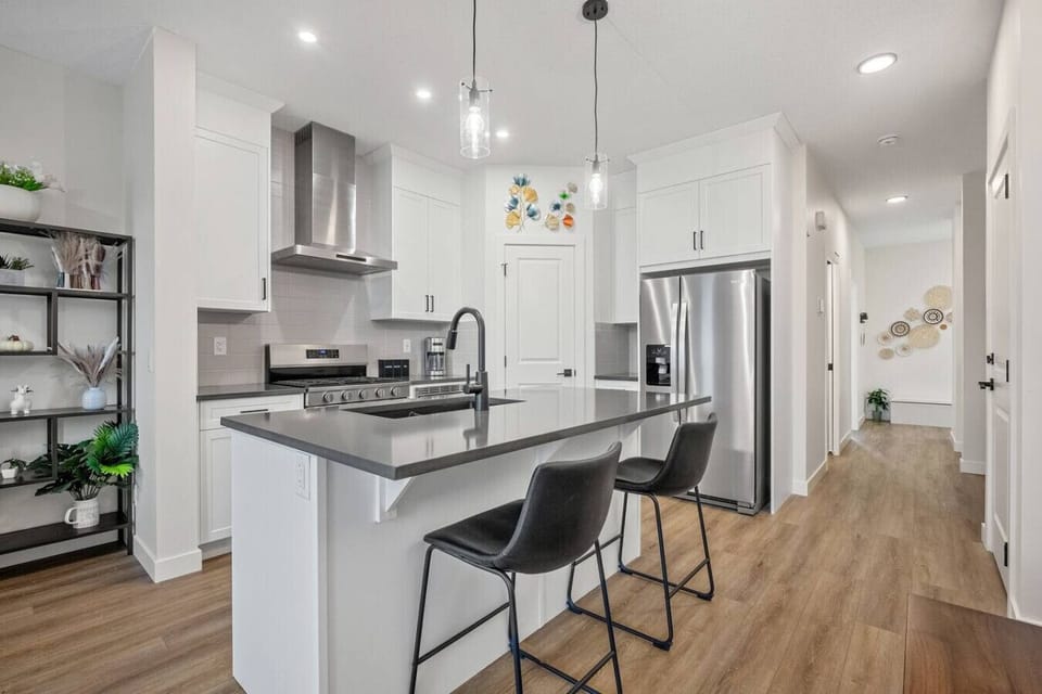 Full kitchen with a drip coffee maker, ground coffee, tea, sugar, basic condiments (ketchup, mustard, relish), and an air fryer.