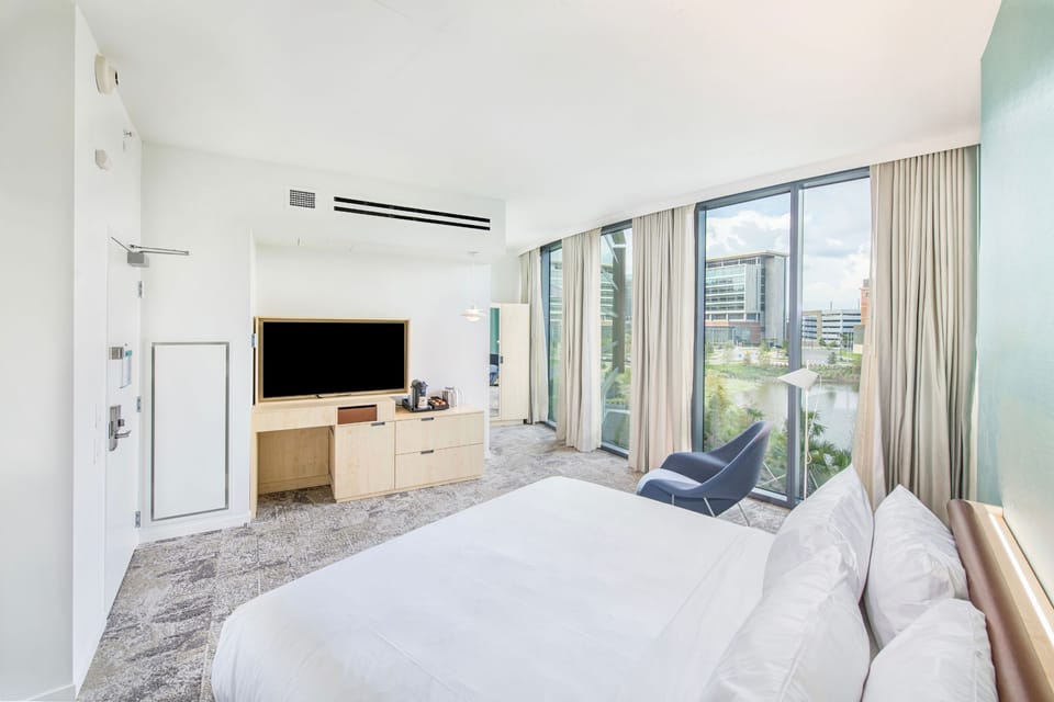 Elegance meets comfort in this stylish lakeside guestroom, perfect for relaxation.
