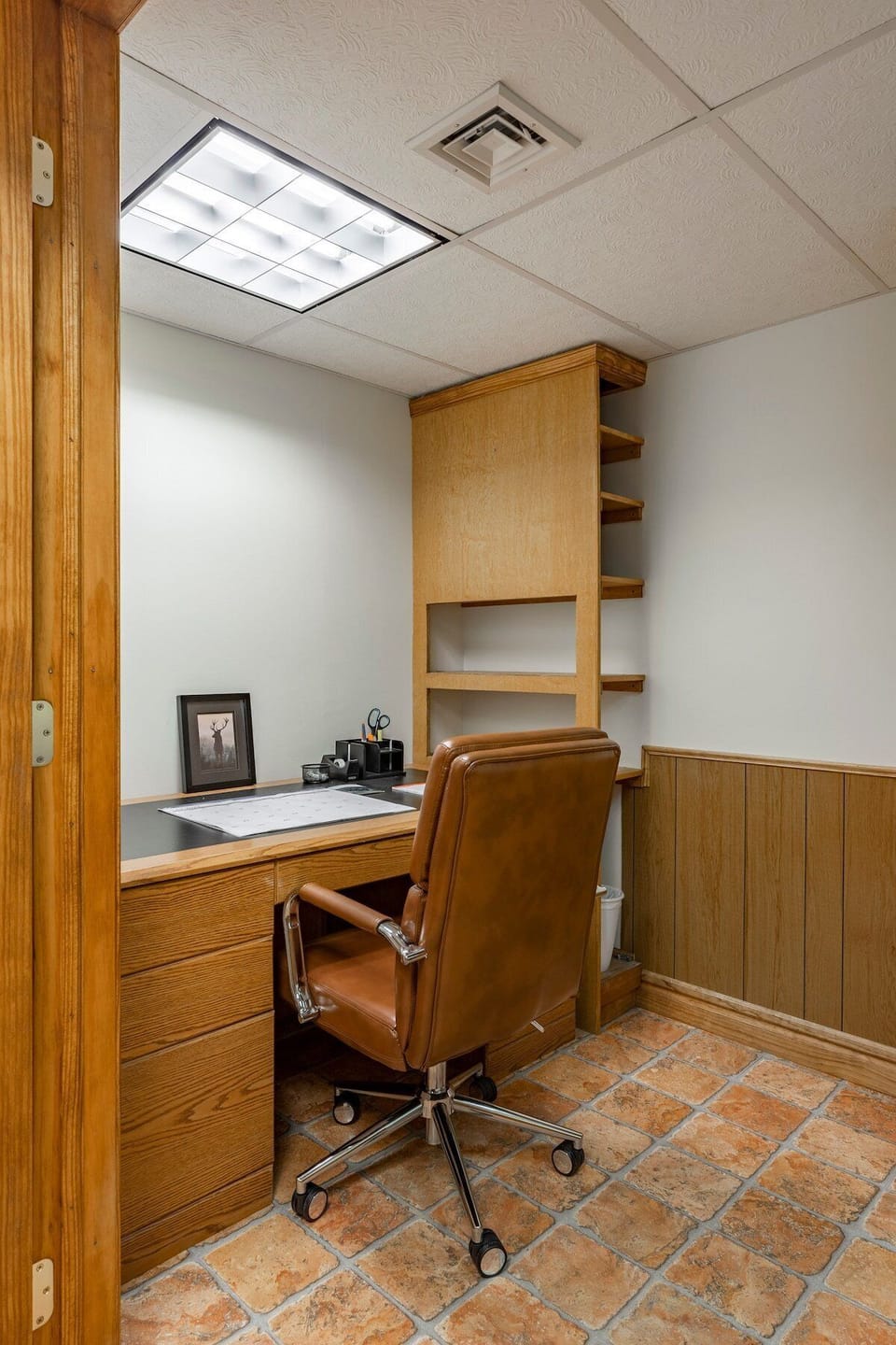 Located in the basement, this room offers privacy for getting work done away from home