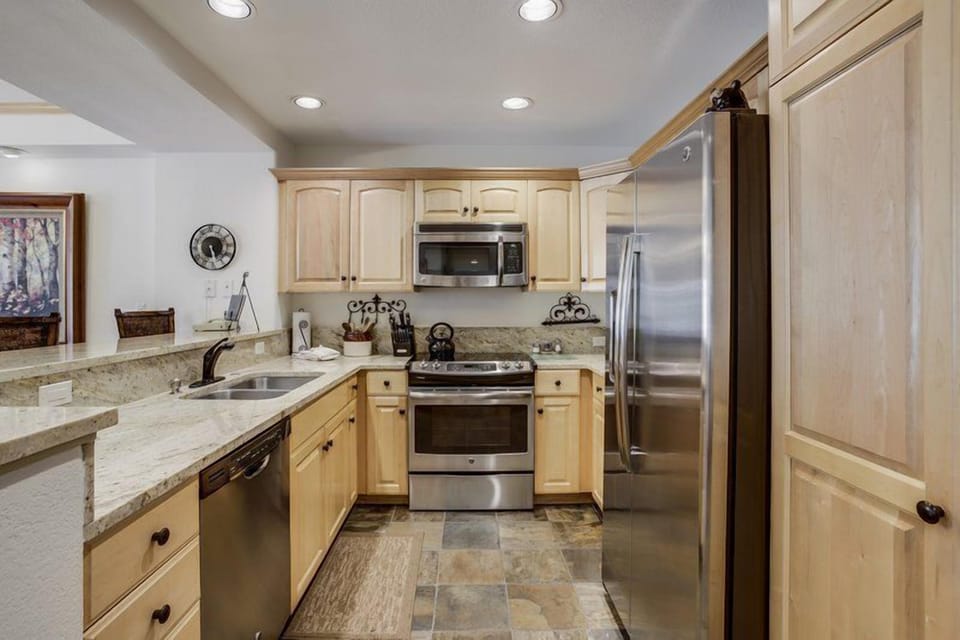 This modern kitchen boasts high-end appliances and elegant cabinetry, perfect for cooking and entertaining in style.