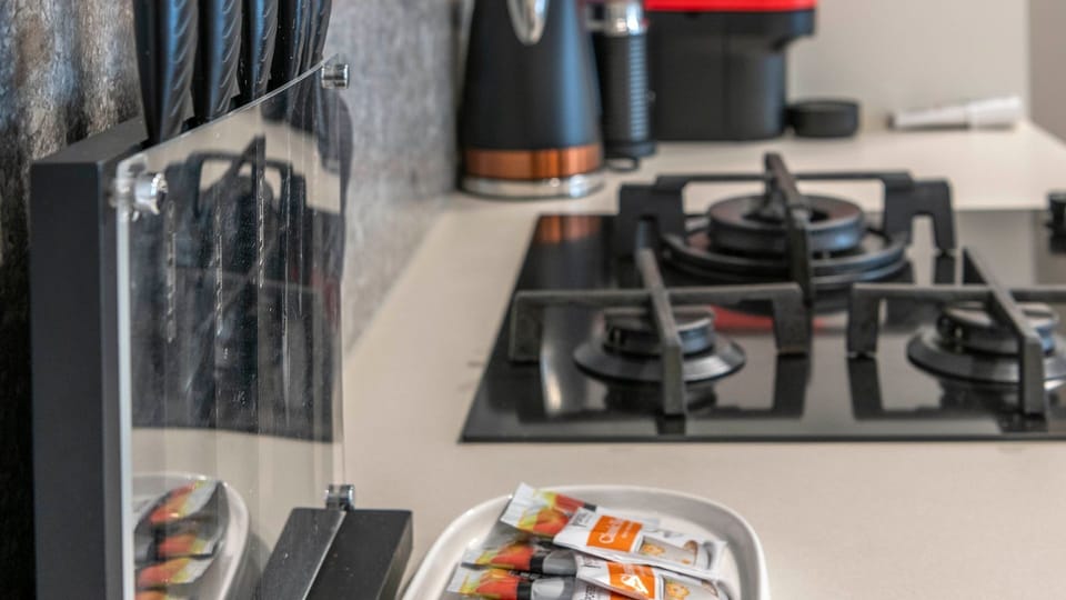 Fully equipped kitchen with quality appliances and cookware.