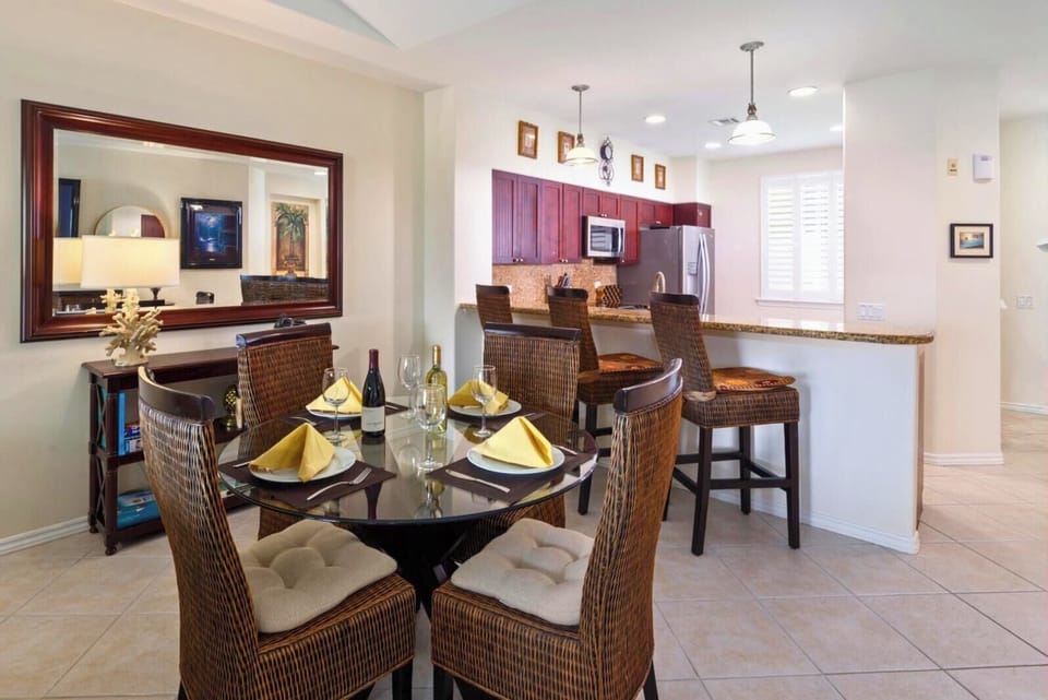 A full dining table with seating for 4 anchors the space for shared meals or evening board games.