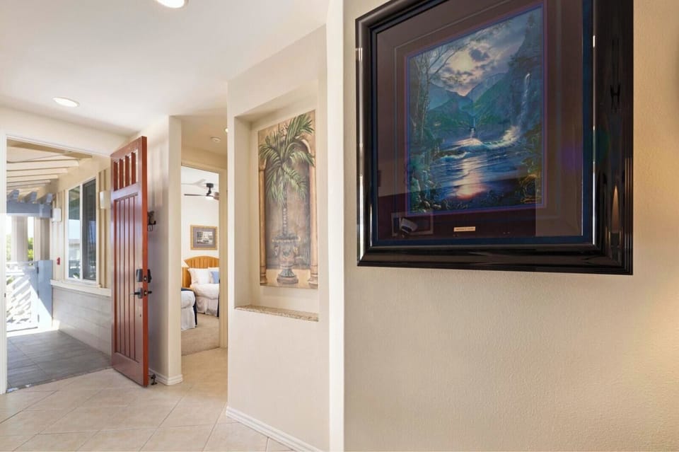 Hallway artwork and finishes add a welcoming touch as you return from your island adventures.