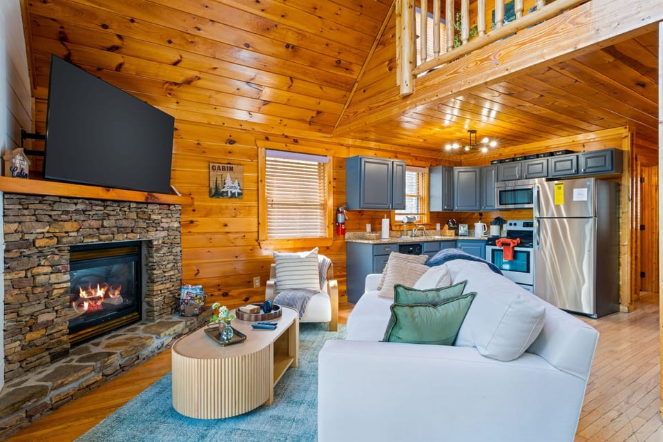 Cozy hygge-inspired cabin living room - the perfect place for a relaxing evening by the gas fireplace. HD TV with streaming services provided. 