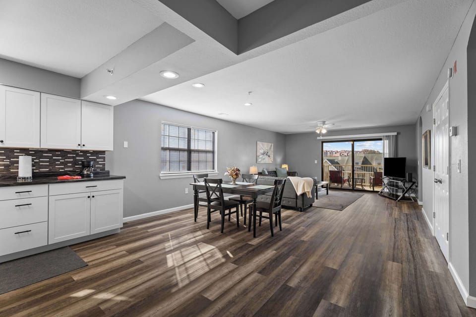 The kitchen overlooks the Dining and Living Rooms.