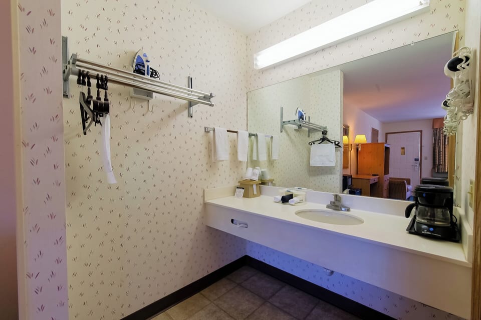 Refresh at the roomy vanity with bright, flattering lighting.