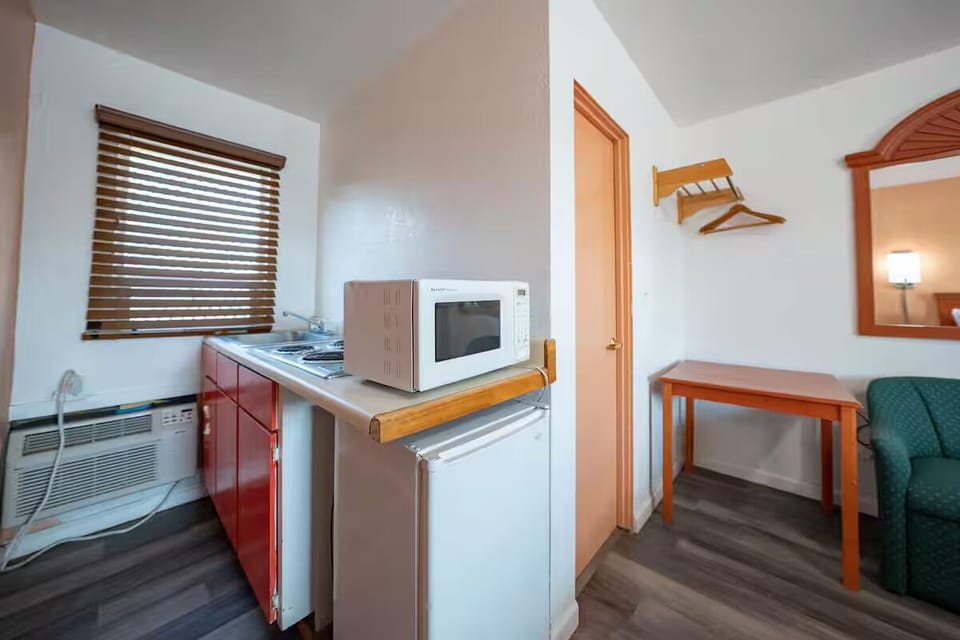 Enjoy quick snacks with microwave, mini fridge, and sink.