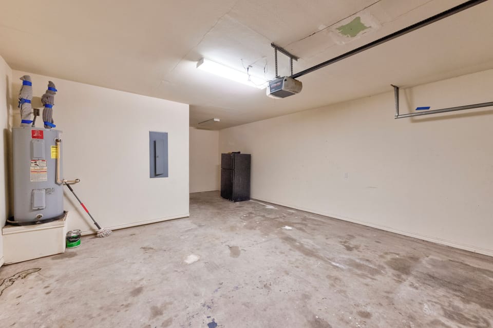 Spacious garage with ample storage room for your gear and vehicle, plus convenient utility access.
