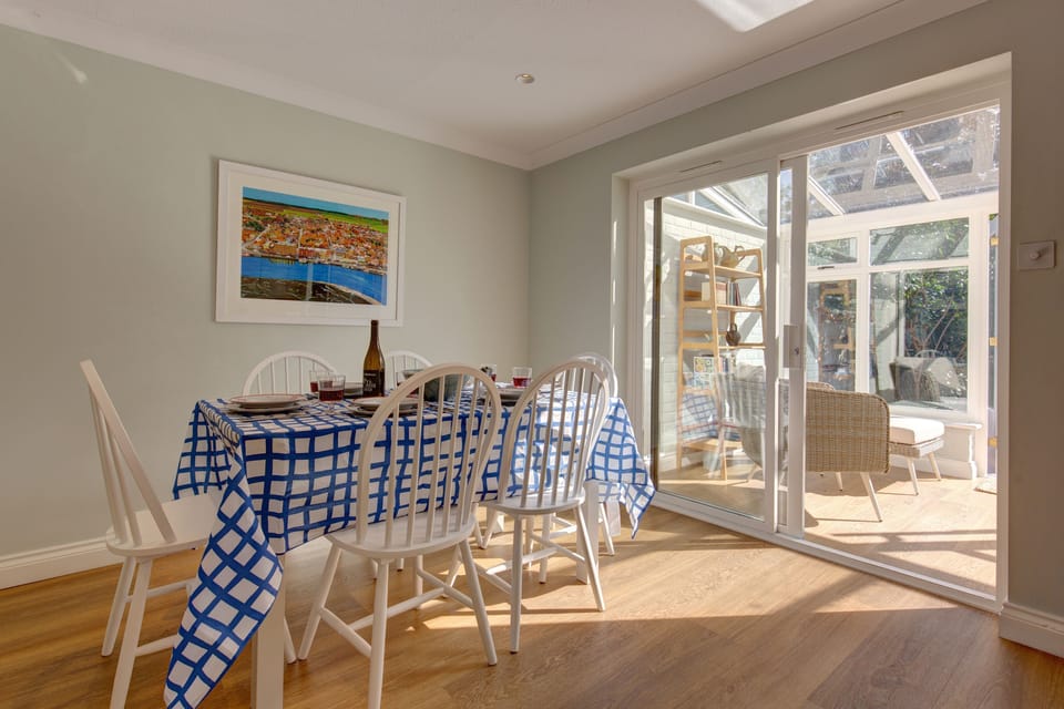 Ground floor: Dining area leading to garden room