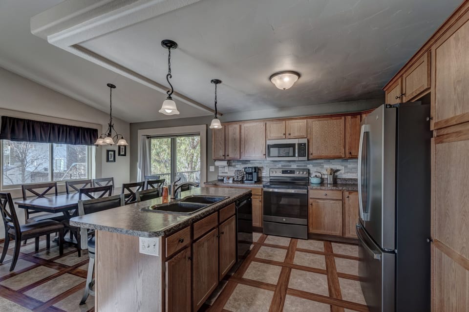 Full size kitchen with all necessary appliances, cookware, bakeware, and utensils