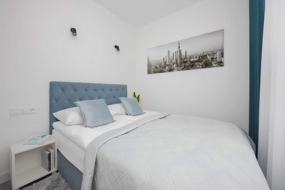 The bright bedroom with soft bedding creates a calming space where guests can fully recharge.