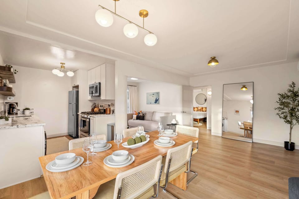 Spacious dining area with modern lighting and open layout