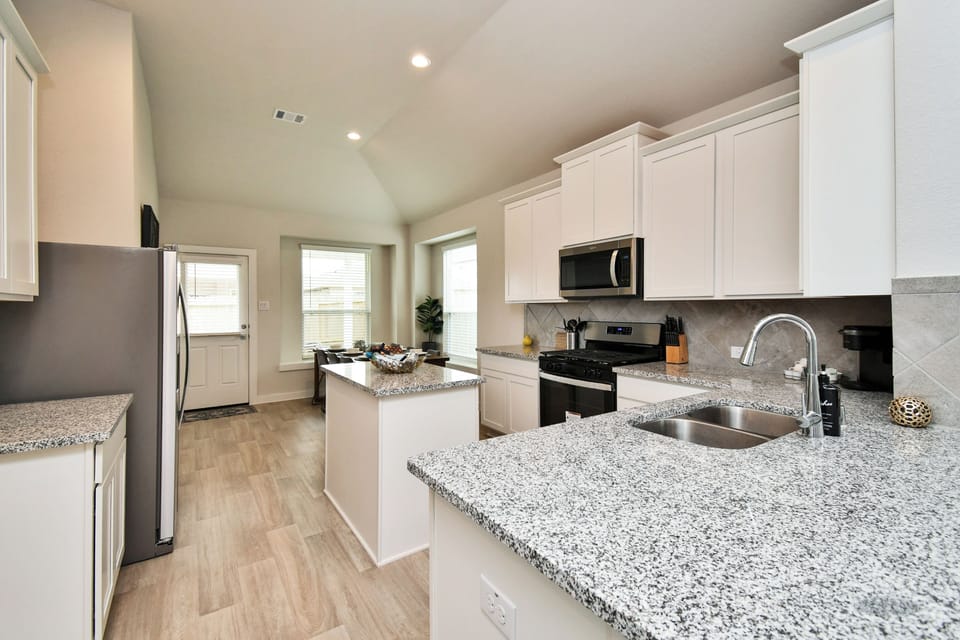 Prep meals effortlessly with the functional kitchen layout.