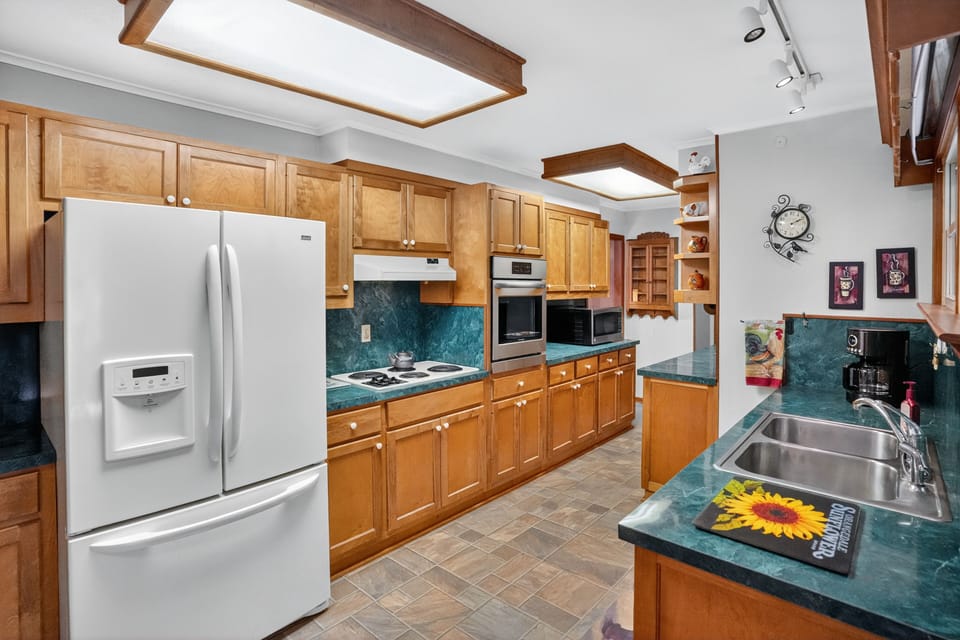 Well-appointed kitchen with generous storage and natural light