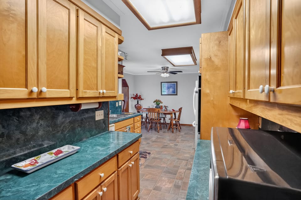 Bright kitchen with skylight and abundant storage space