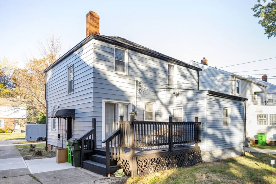 Enjoy the outdoors in this expansive, fenced-in backyard, featuring a lush green lawn and a spacious concrete patio perfect for morning coffee or afternoon relaxation in complete privacy.
