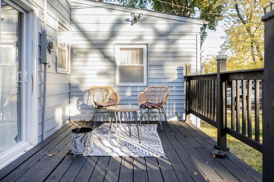 Enjoy the outdoors in this expansive, fenced-in backyard, featuring a lush green lawn and a spacious concrete patio perfect for morning coffee or afternoon relaxation in complete privacy.