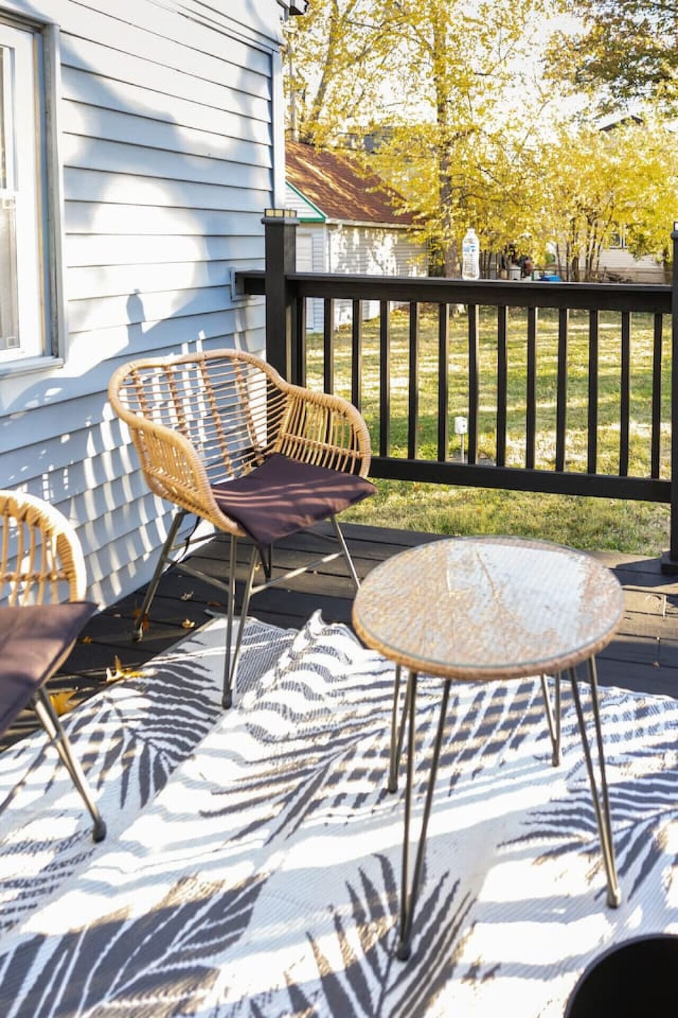 Enjoy the outdoors in this expansive, fenced-in backyard, featuring a lush green lawn and a spacious concrete patio perfect for morning coffee or afternoon relaxation in complete privacy.