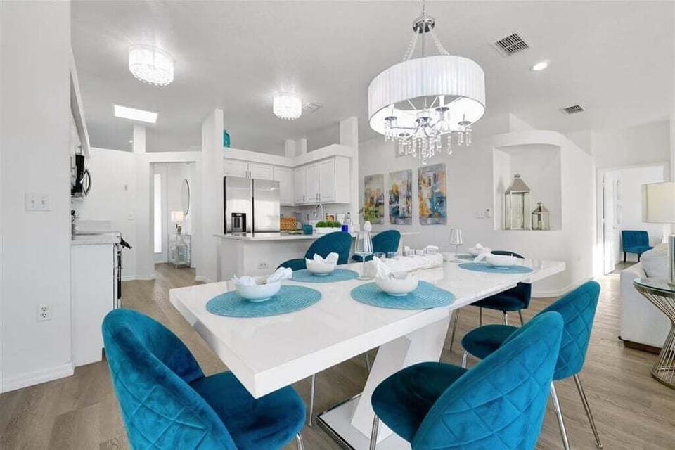 Step into a dining space that exudes timeless elegance and effortless sophistication. This beautifully designed area is perfect for intimate dinners, family gatherings, and special celebrations.