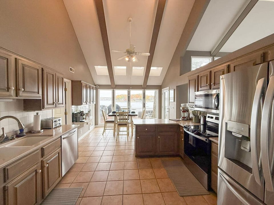 Bright, fully equipped kitchen with lakeview dining.