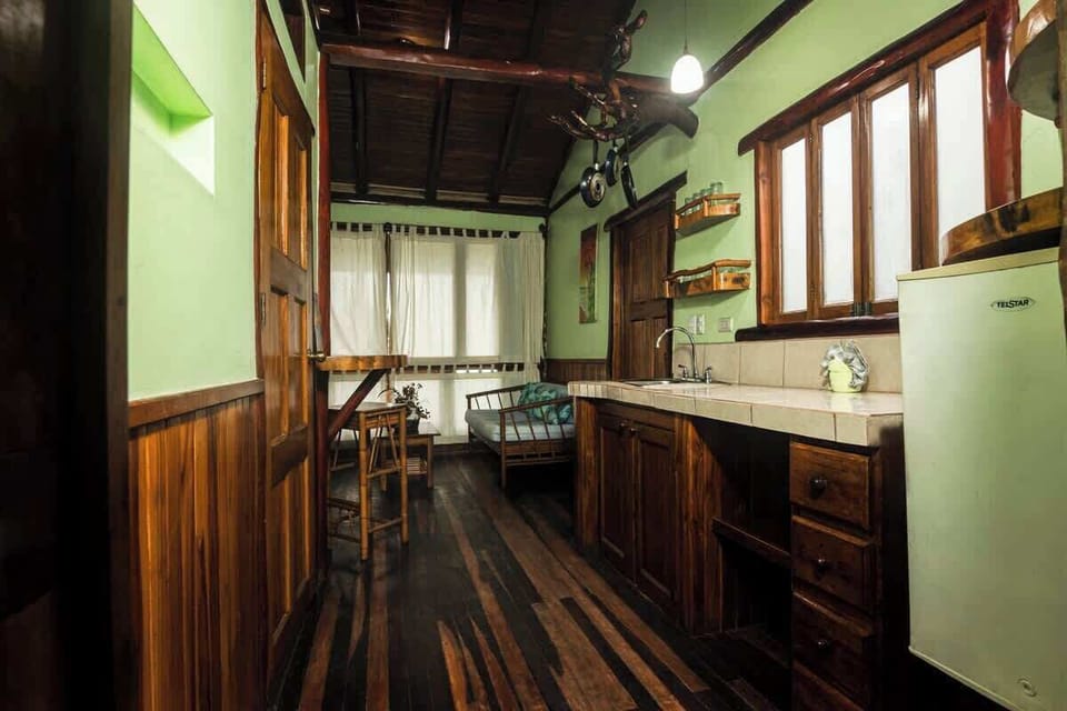 Kitchenette in each unit for your convenience. Small refrigerator, sink, and cooktop. Also dishes, pots and pans and utensils.