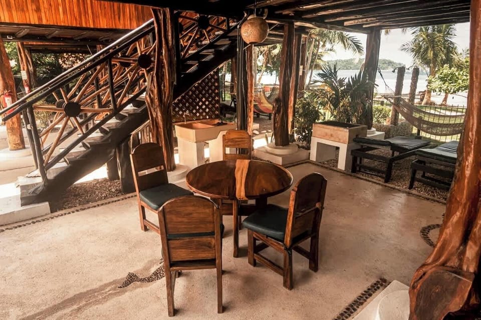 Eating area under the treehouse for your pleasure. Also two hammocks and chaise lounges. Outdoor grill for each guest.
