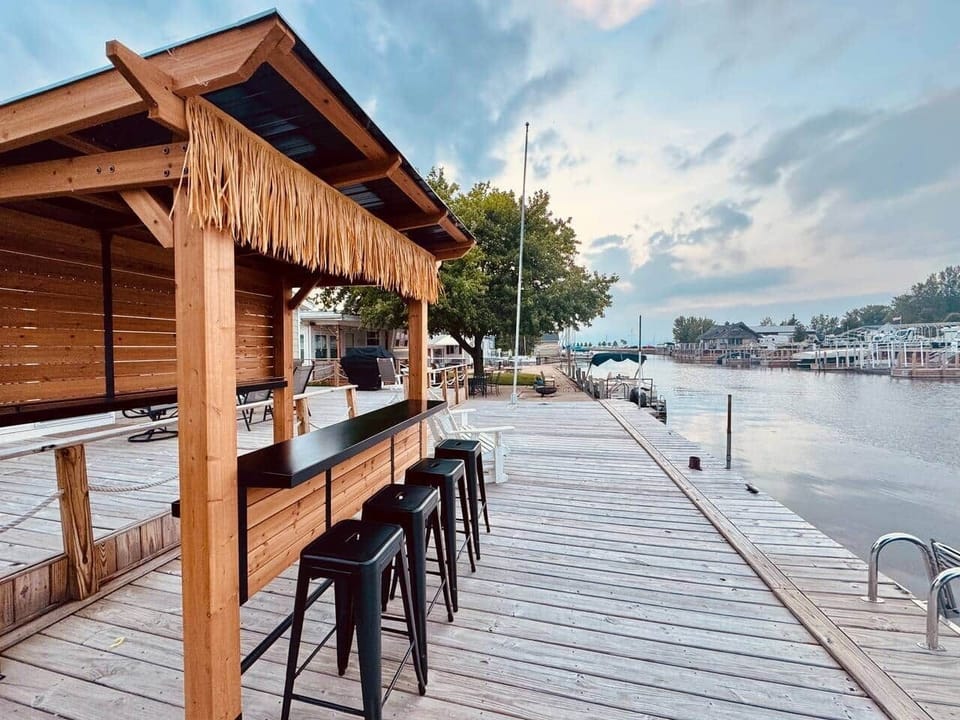 Outdoor tiki bar on the deck! You can sit outside and watch the boats go by all day! You can also dock your boat right at the patio and be out to Lake Huron in a few minutes.
